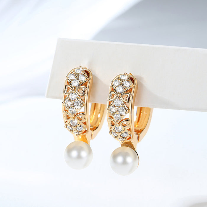 Wholesale Copper gold-plated retro light luxury simple pearl earrings, small and fashionable design, inlaid with zircon ear buckles, wholesale of ear accessories