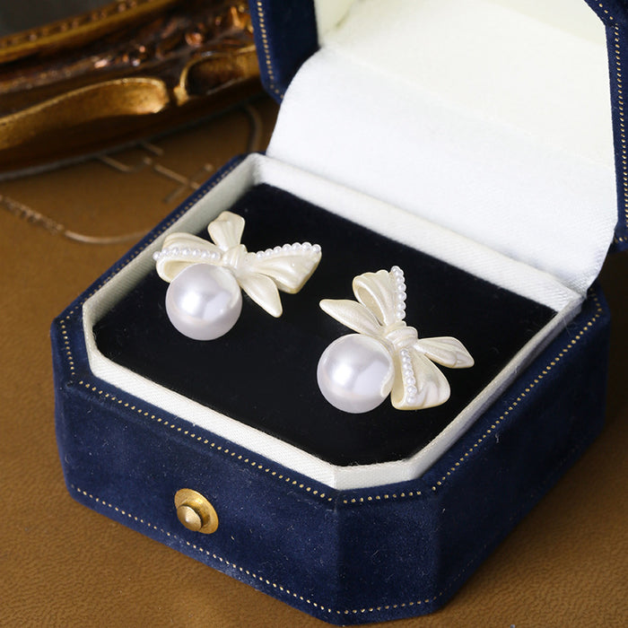 Wholesale White copper silver needle bow lily of the valley pearl earrings women's screw buckle