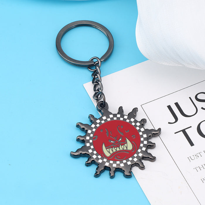 Wholesale Zinc alloy red demon face sun pendant keychains