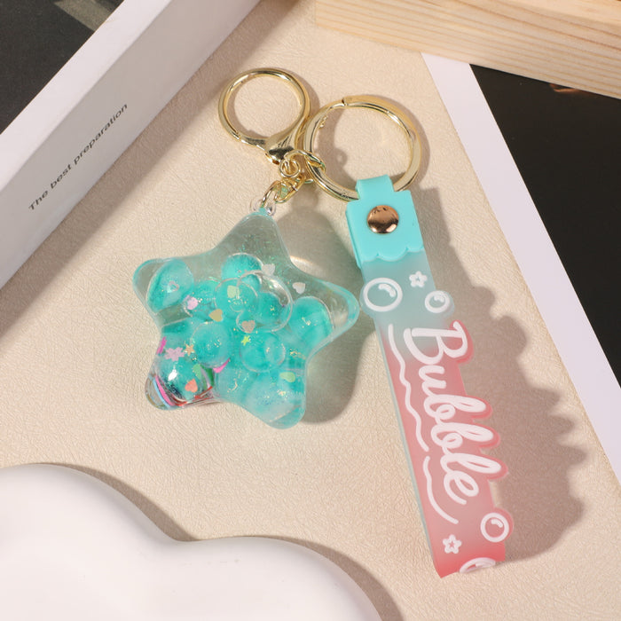 Wholesale five-pointed star flower quicksand bottle creative colorful cartoon bag key chain jewelry small pendant ornaments color