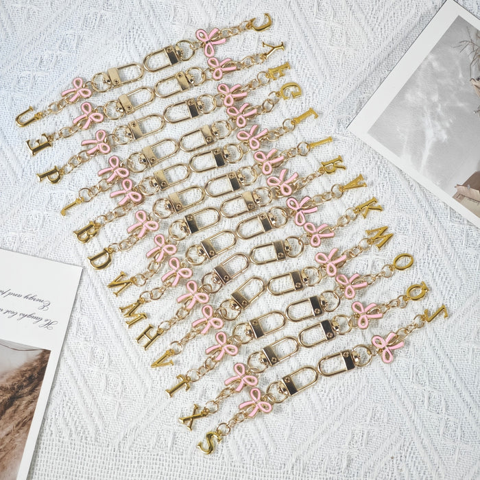 Wholesale Pink bow A-Z keychain alloy accessory