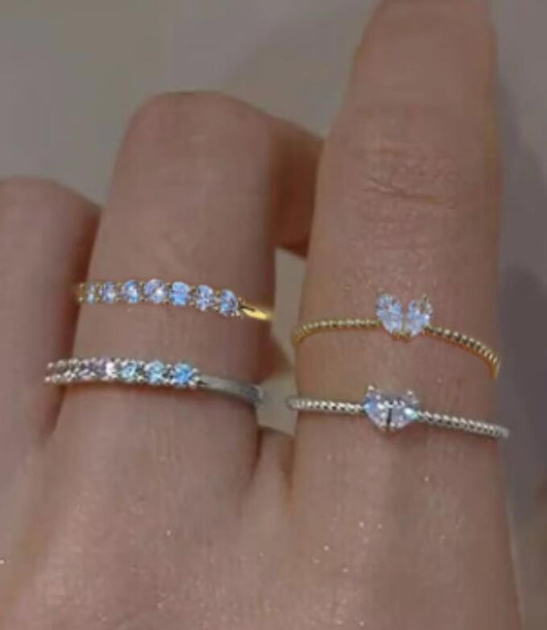 Wholesale Set of open-faced diamond-encrusted heart-shaped rings.