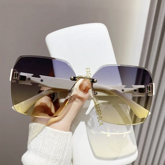 Wholesale Advanced frameless sunglasses, fashionable outdoor UV protection, driving sunshade