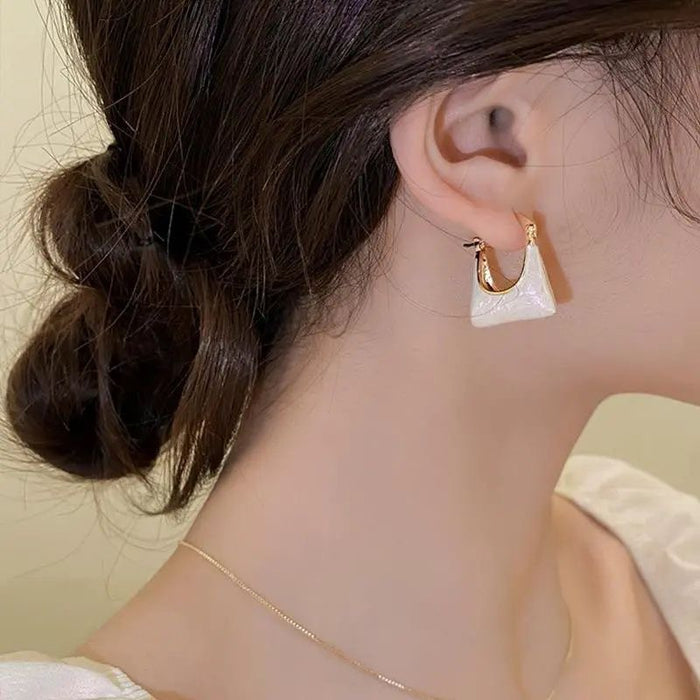 Wholesale Silver needle bag earrings, niche, light luxury design, high-end wholesale earrings