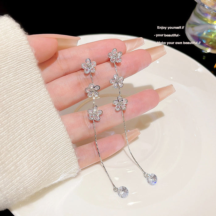 Wholesale Temperament long tassel earrings for female niche design, high-end earrings, new copper zircon petal earrings