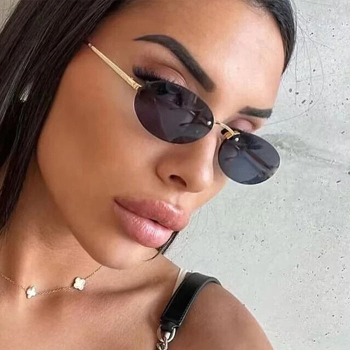 Wholesale Frameless metal oval sunglasses, fashionable and personalized small frame sunglasses
