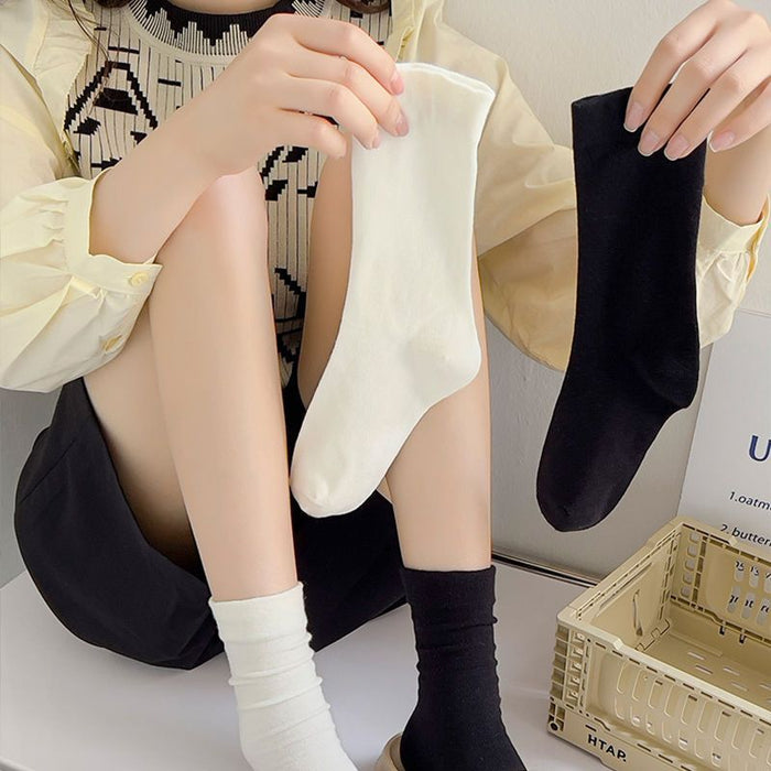 Wholesale White mid length socks made of pure cotton, high cut, and elastic, long socks that absorb sweat and pile up socks