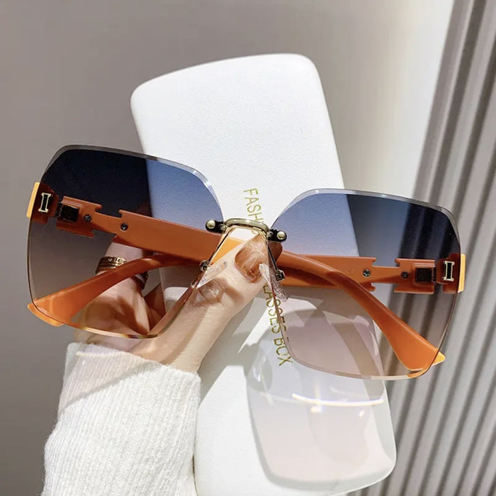 Wholesale Advanced frameless sunglasses, fashionable outdoor UV protection, driving sunshade