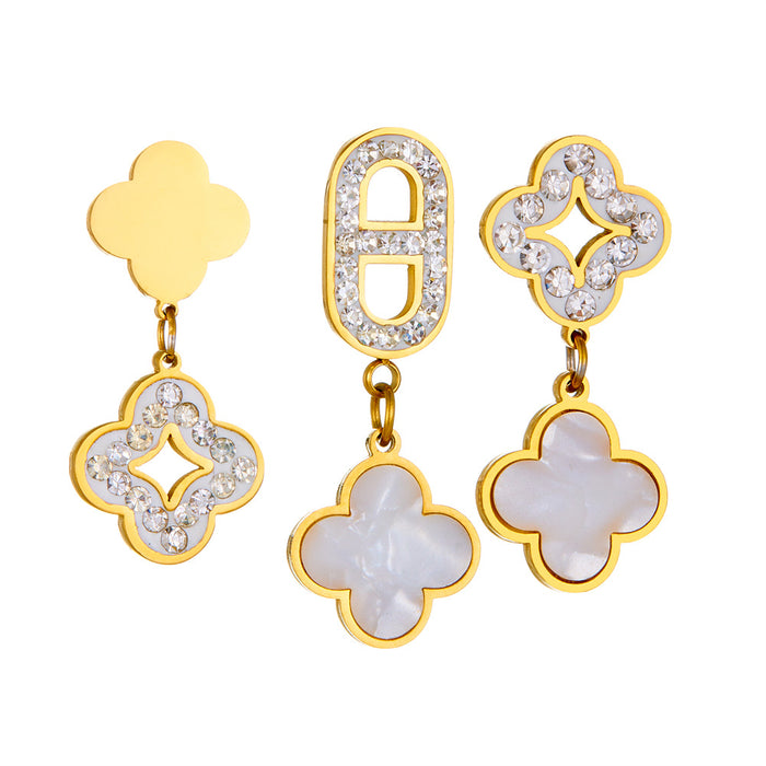 Wholesale Three four-leaf clover-shaped earrings with diamond embellishments.