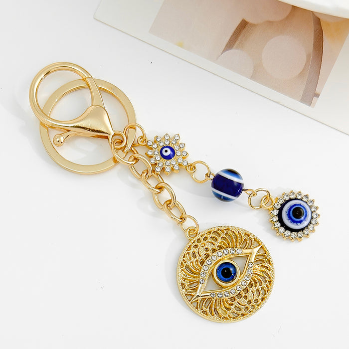 Wholesale Diamond-encrusted blue eyes evil eye tassel keychain