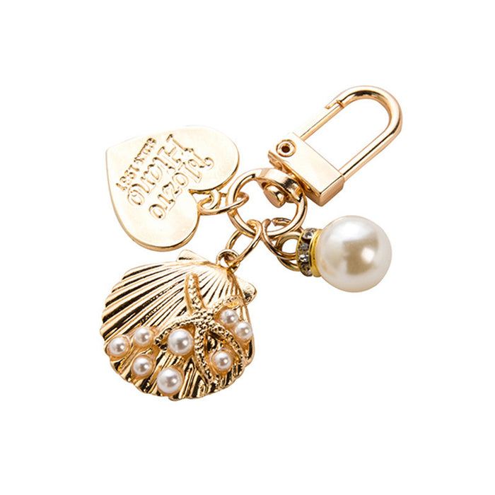 Wholesale Wholesale of metal keychains, cute shell key pendants, wholesale of bags and pendants, creative small gifts for gifting
