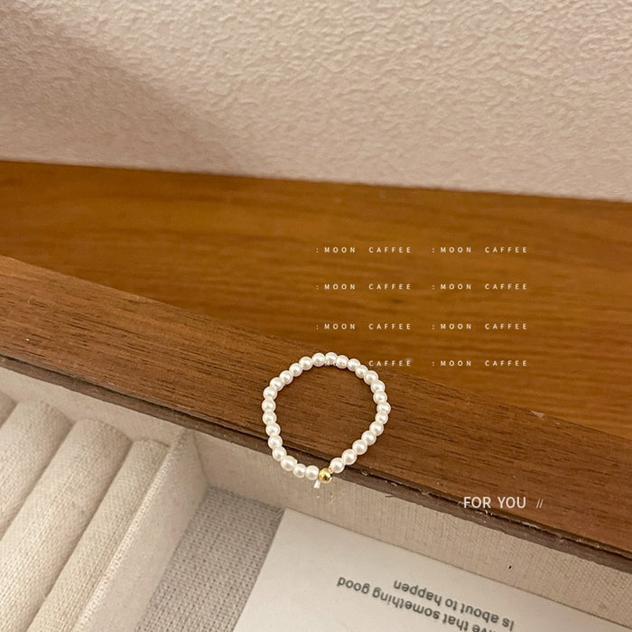 Wholesale Light luxury mini pearl bead elastic rope ring with a retro temperament that does not touch the wrist circumference, freshwater pearl ring