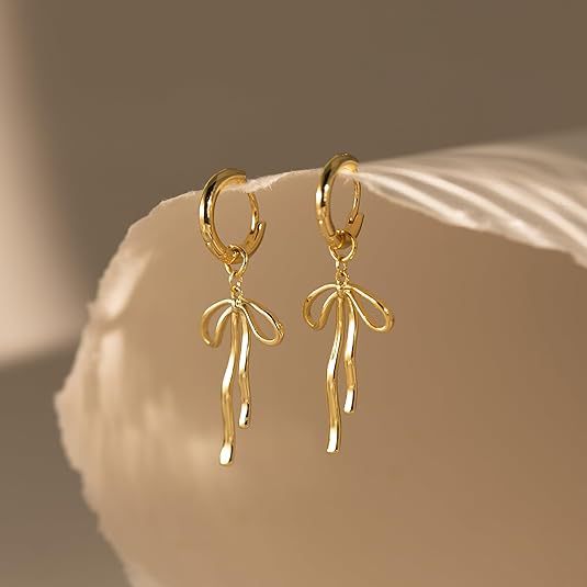 Wholesale Fashionable long bow pendant, ear buckle, ear ring, tassel shaped high-end earrings, brass genuine gold electroplating