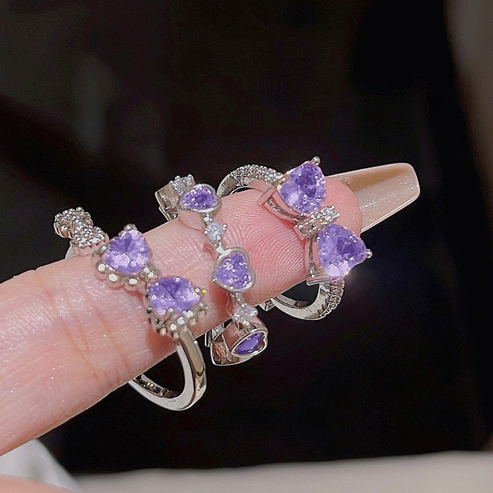 Wholesale Set of open-faced diamond-encrusted heart-shaped rings.