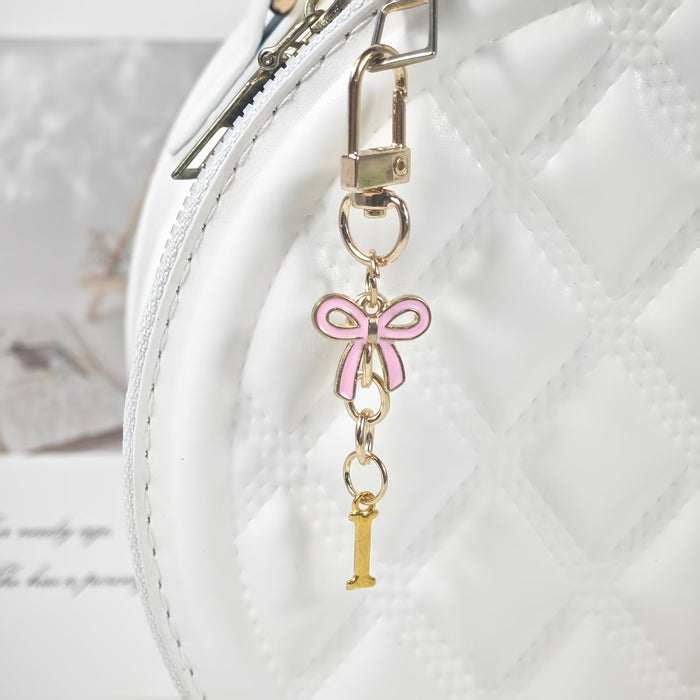 Wholesale Pink bow A-Z keychain alloy accessory
