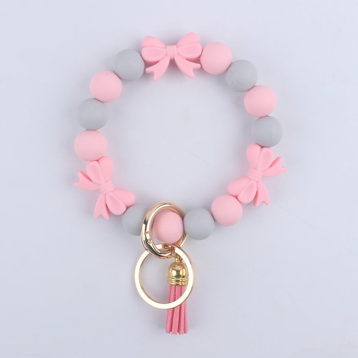 Wholesale PU Cartoon Bowknot Silicone Handmade Beaded Wrist Keychain JDC-KC-GuangTian006