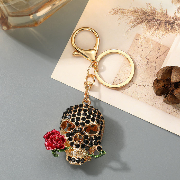 Wholesale Trendy Rhinestone Skull Keychain with Zinc Alloy Bag Charm