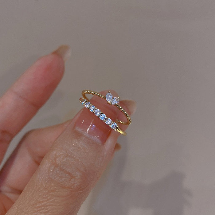 Wholesale Set of open-faced diamond-encrusted heart-shaped rings.