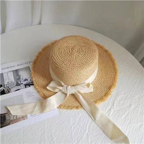 Wholesale Big brim frayed Lafite grass hat women's beach hat for beach vacation, sun protection and sunshade hat