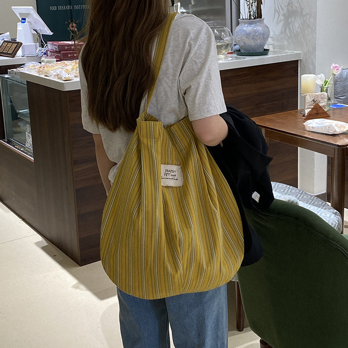Wholesale Splicing striped canvas bag with simple temperament and large capacity commuting shoulder bag