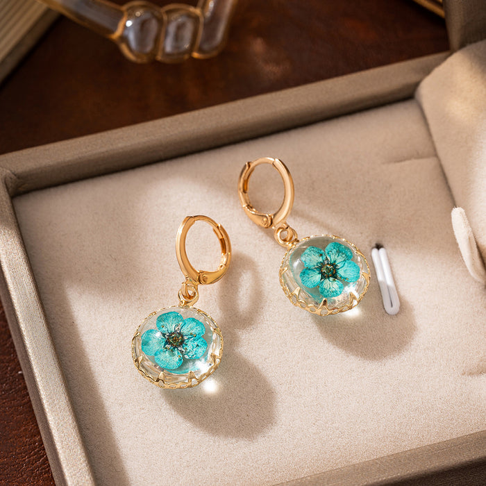 Wholesale Transparent circular glass ball earrings, irregular eternal flower earrings, flower beach accessories in style
