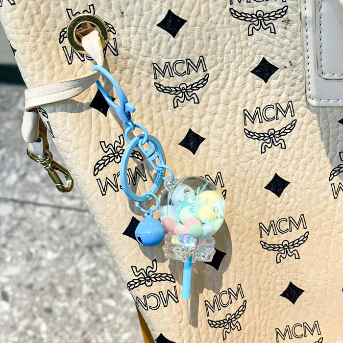 Wholesale Creative oil colored bead lollipop keychain cute cartoon car couple bag pendant small gift
