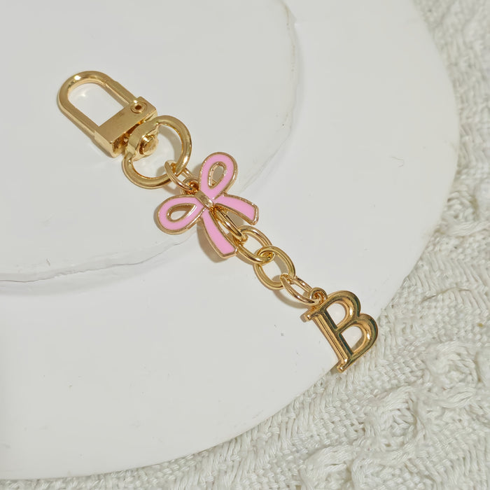 Wholesale Pink bow A-Z keychain alloy accessory