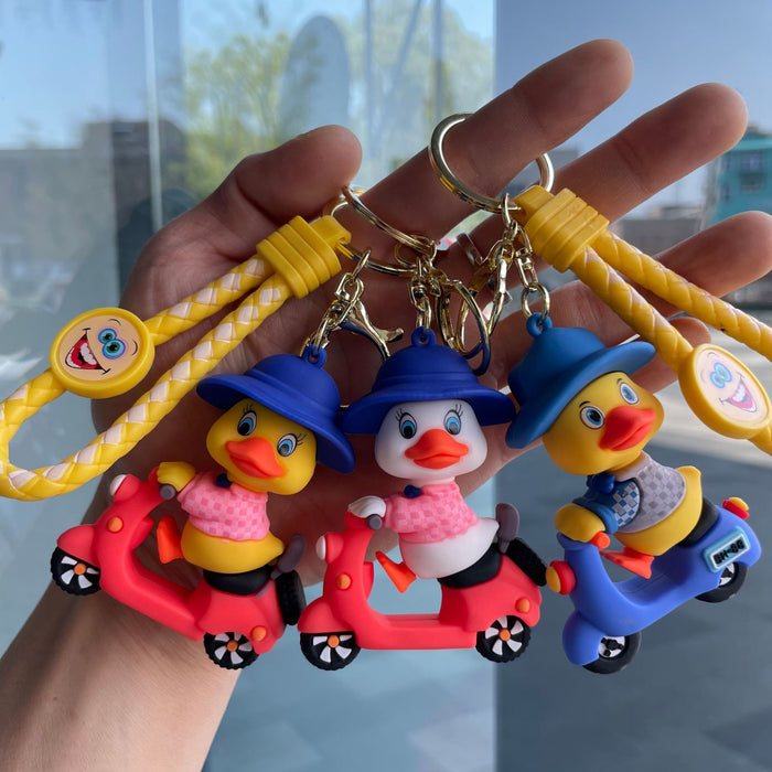 Wholesale Tram couple duck keychain couple backpack pendant claw machine doll car keychain exquisite small gift wholesale