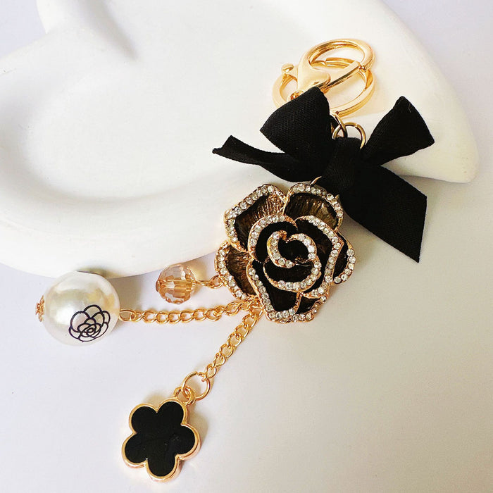 Wholesale Rhinestone Bow Pearl Tassel Camellia Zinc Alloy Keychain JDC-KC-ZhanLun014