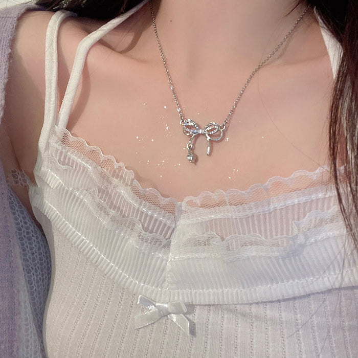 Wholesale Bow studded diamond hollow necklace, light luxury high-end pendant, niche design, collarbone chain