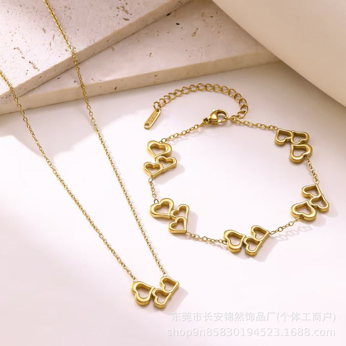 Wholesale Hollow out three-heart stainless steel necklace and bracelet set