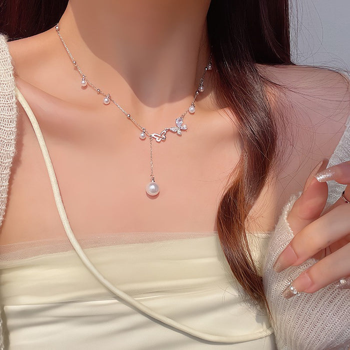 Wholesale Asymmetric hollow butterfly pearl necklace, light luxury, niche collarbone chain accessory, neckchain
