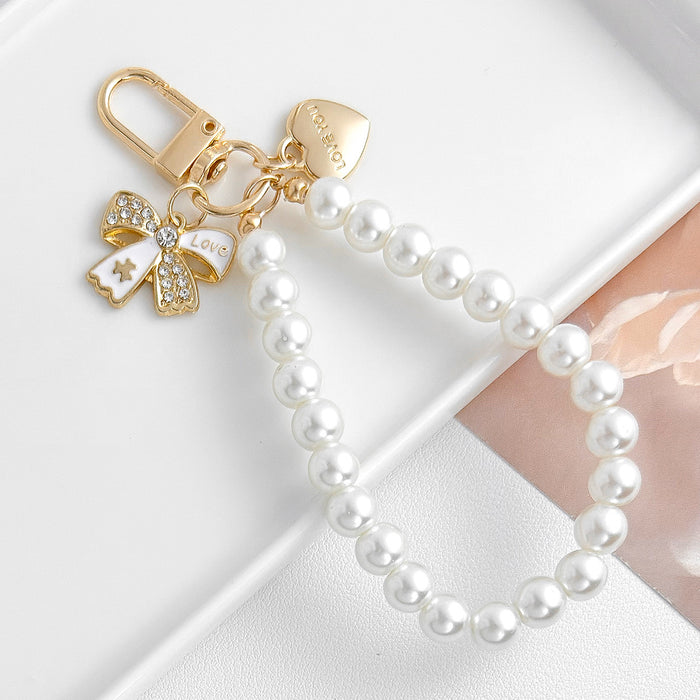 Wholesale Pearl chain beaded mobile phone lanyard bow pendant keychain