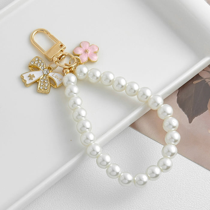 Wholesale Pearl chain beaded mobile phone lanyard bow pendant keychain