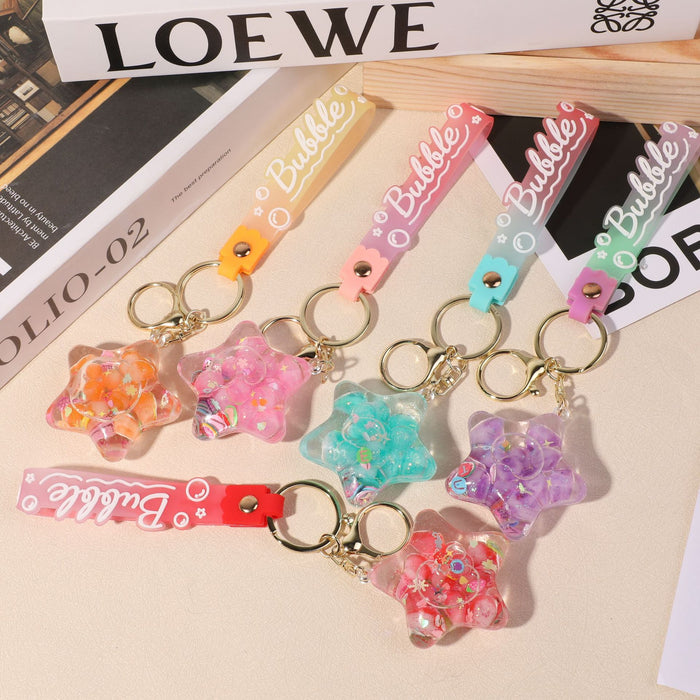 Wholesale five-pointed star flower quicksand bottle creative colorful cartoon bag key chain jewelry small pendant ornaments color