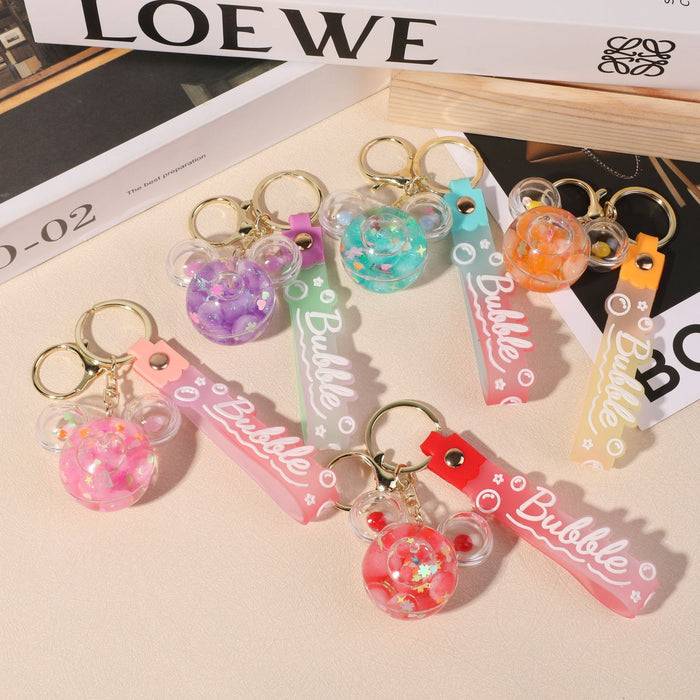 Wholesale quicksand bottle keychain wholesale floating liquid crystal key chain school bag pendant car keychain