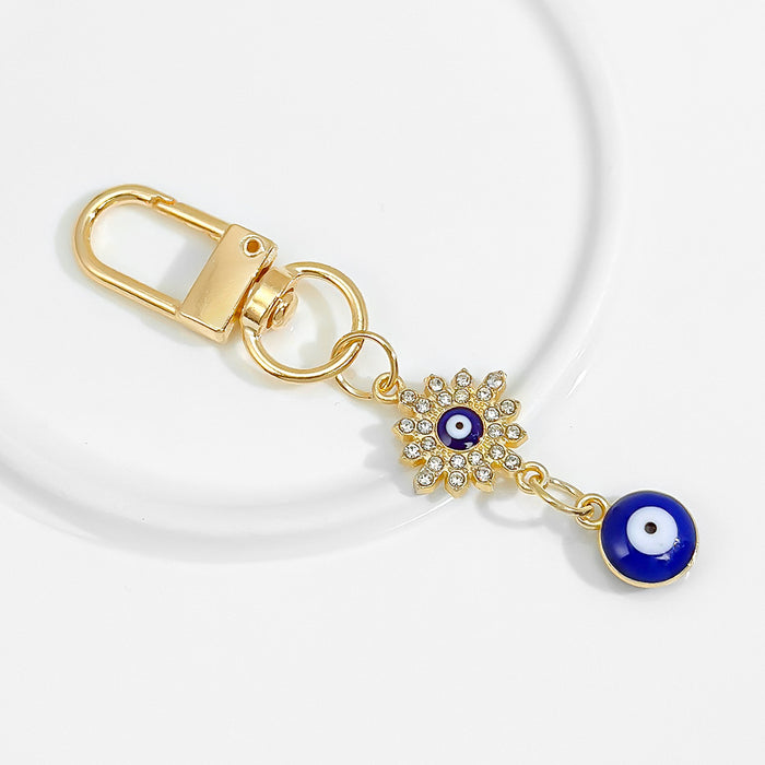Wholesale Diamond-encrusted blue eyes evil eye tassel keychain