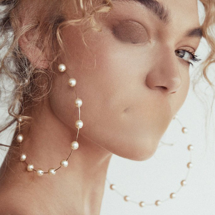 Wholesale Alloy jewelry earrings, silver pearl earrings, fashionable and exaggerated pearl earrings, women's ring earrings, personality