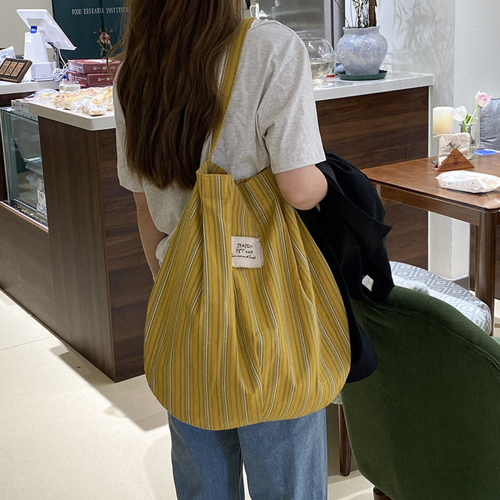 Wholesale Splicing striped canvas bag with simple temperament and large capacity commuting shoulder bag