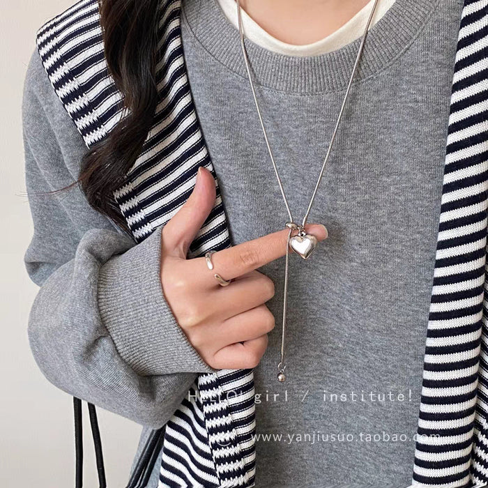 Wholesale Minimalist silver heart pendant necklace, women's light luxury high-end feel, long sweater chain accessory