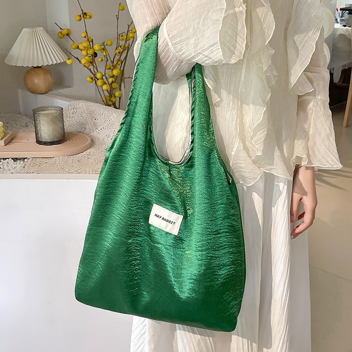 Wholesale Small niche design, environmentally friendly silver shoulder bag, large capacity leisure commuting shopping bag, handheld
