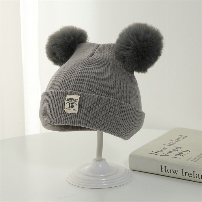 Wholesale Knitted hat with added yarn cap and fabric label