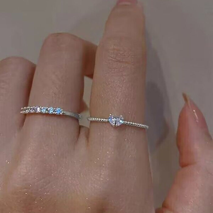 Wholesale Set of open-faced diamond-encrusted heart-shaped rings.