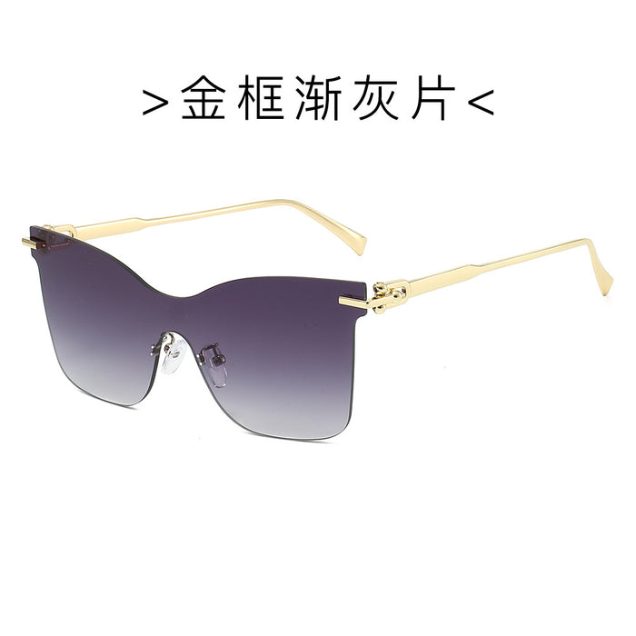Wholesale Frameless one-piece sunglasses with a high-end feel, personalized trendy glasses, UV resistant cat eye retro sunglasses