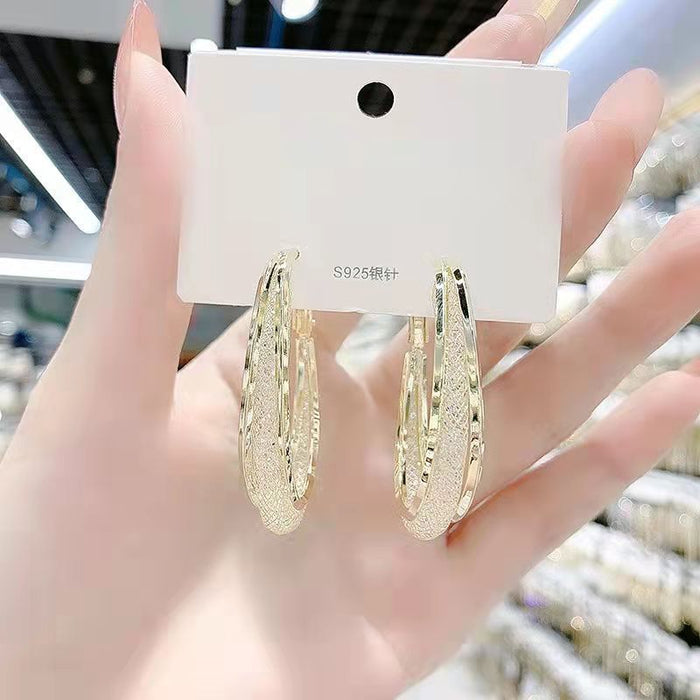 Wholesale Metal earrings with hollowed out mesh and crystal circles, earrings with a subtle touch of elegance, and female earrings with inlaid details