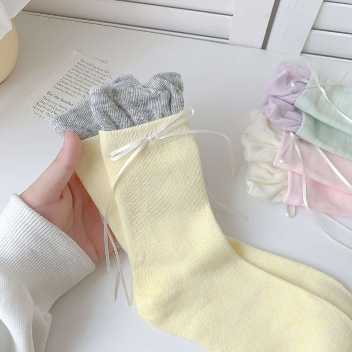 Wholesale Butterfly knot pile socks, cute and versatile pile socks
