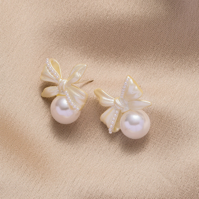 Wholesale White copper silver needle bow lily of the valley pearl earrings women's screw buckle