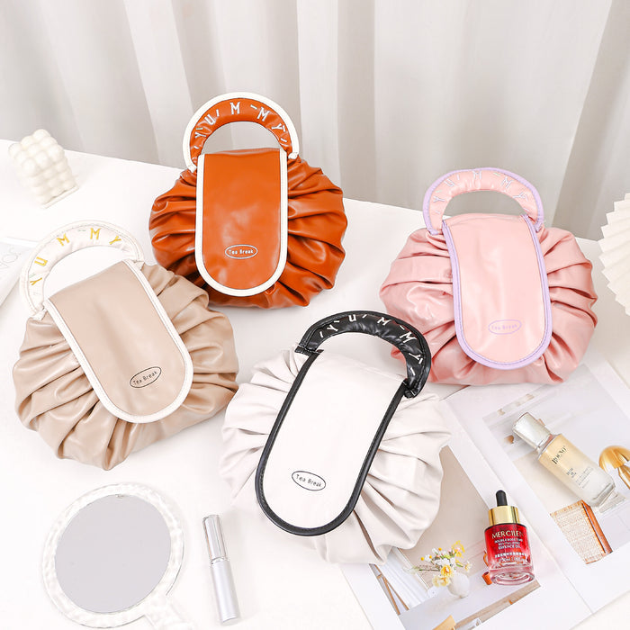 Wholesale PU Pink Cylindrical Cosmetic Bag Light Luxury Drawstring Travel Makeup Pouch For Women