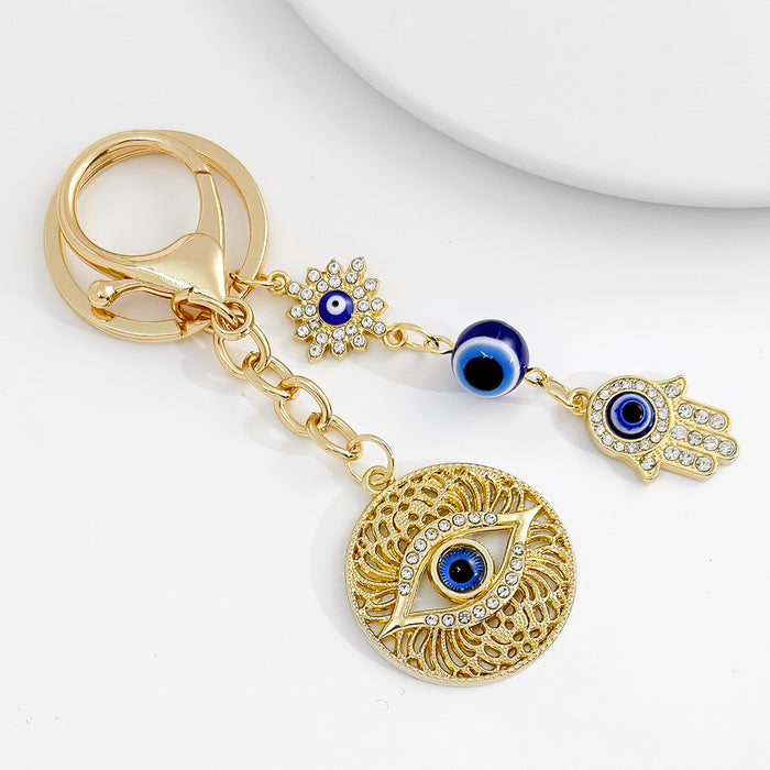 Wholesale Diamond-encrusted blue eyes evil eye tassel keychain