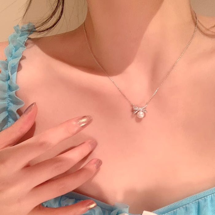 Wholesale Titanium steel pearl bow necklace, new high-end, light luxury collarbone chain accessory